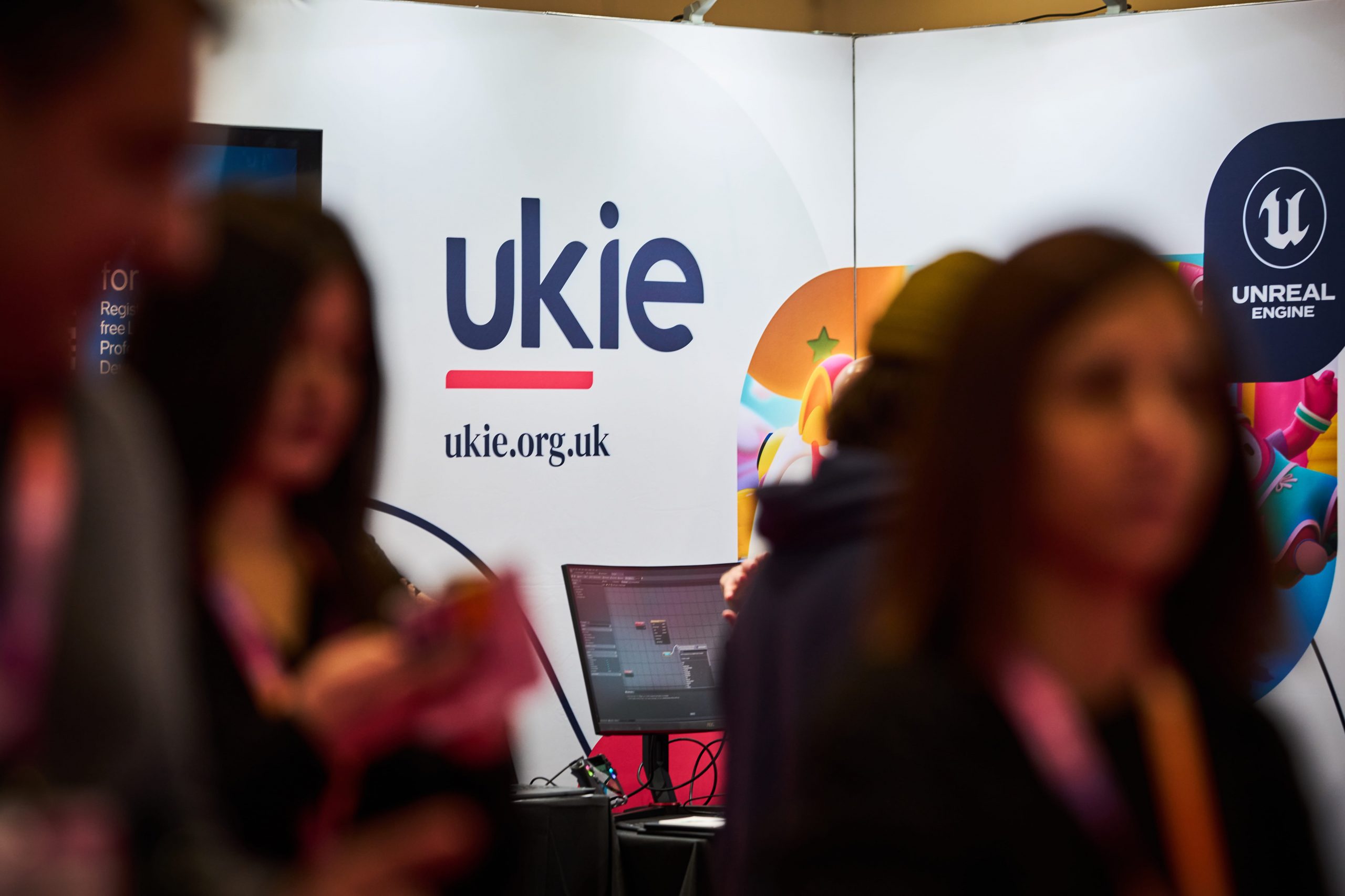 Large Ukie logo on a white event banner at BETT 2025