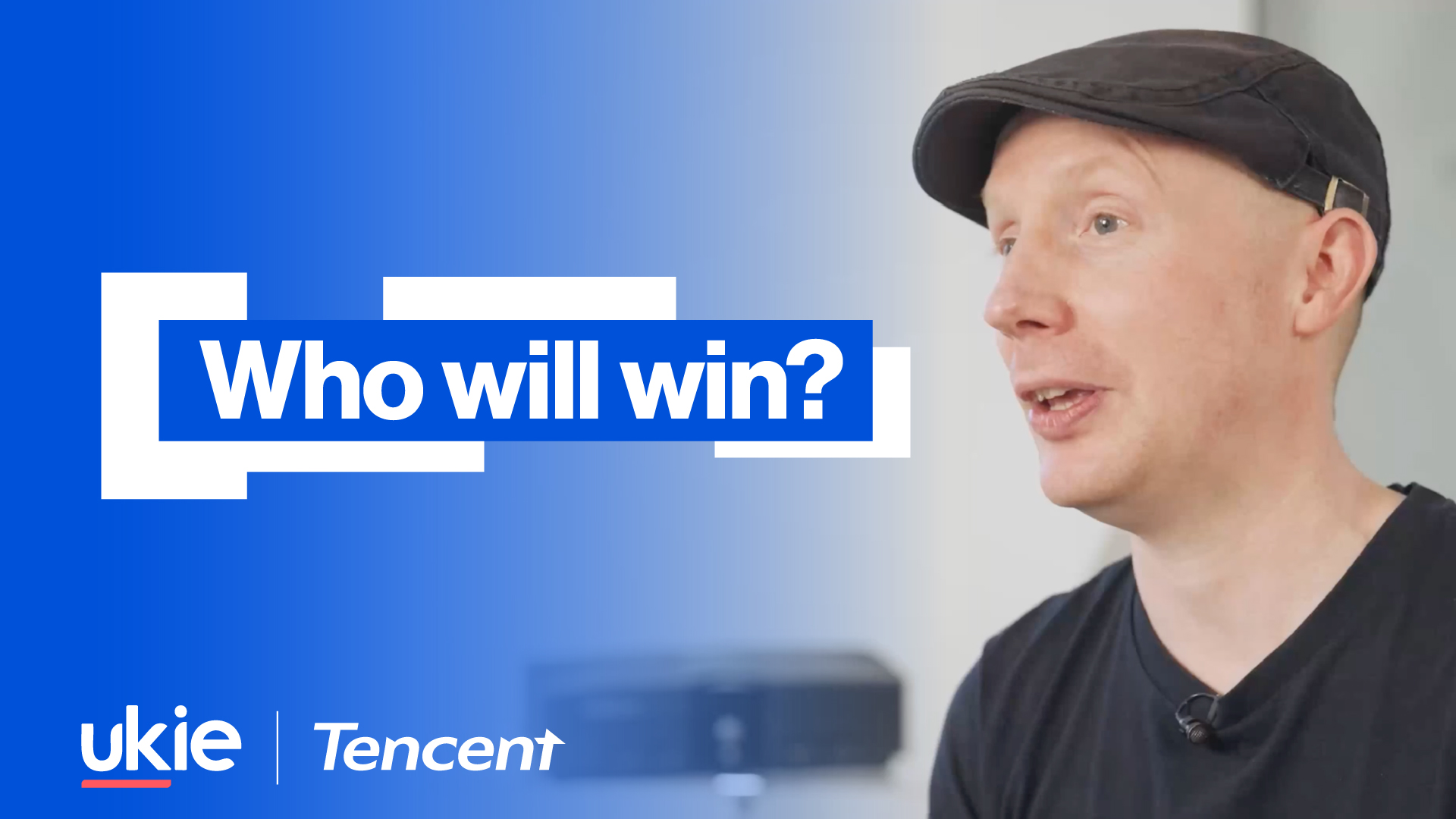 Ukie graphic with text 'Who will win?' on a blue gradient background with a picture of Rob Hewson wearing a flat peak hat and black t-shirt to the right